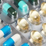 Different pills arranged on a table.