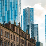 Image of Manchester high rise buildings above older buildings