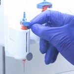 Hand working on bioprinter
