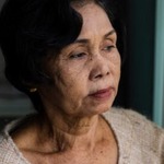 Ethnic minority woman looking out the window