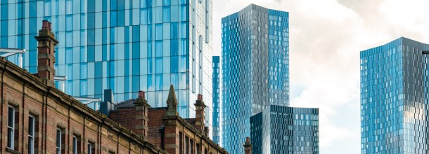 Image of Manchester high rise buildings over older buildings
