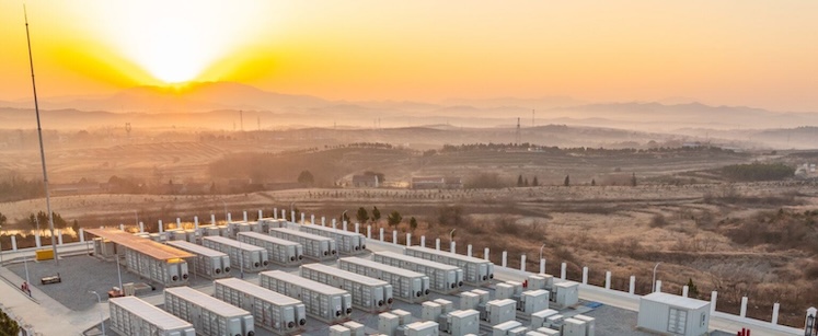 A battery storage facility in a desert with a bright sun