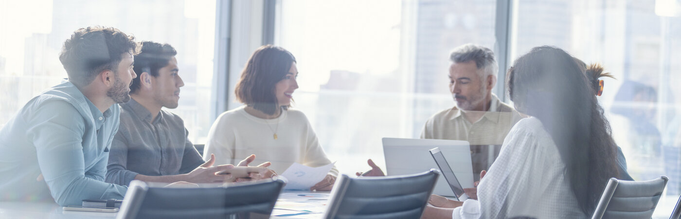 People in a meeting room networking and discussing business