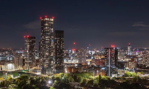 a city scene lit up at night.