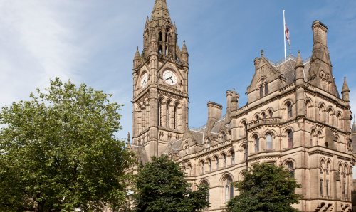 Manchester Townhall building with trees in foreground